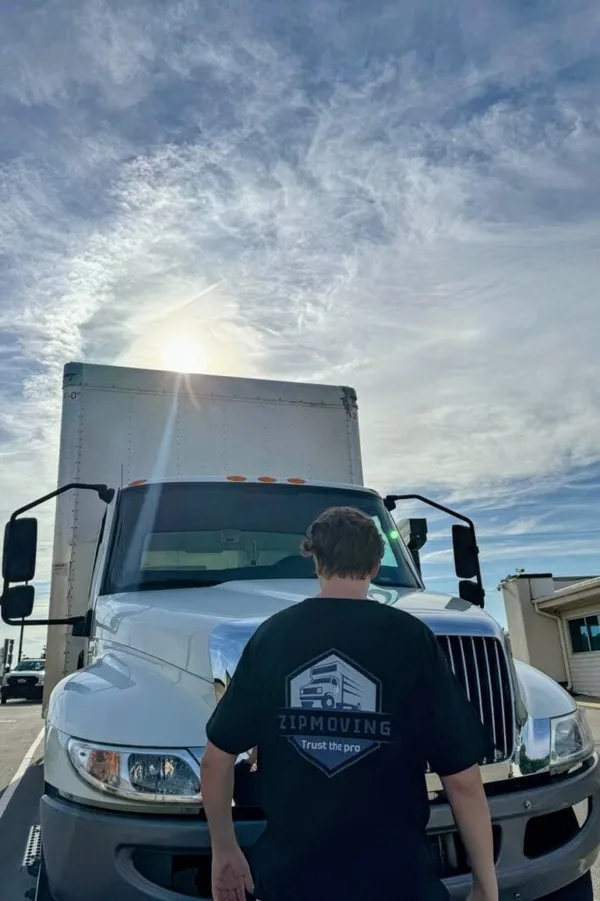 ZIP Moving crew member standing in front of the moving truck